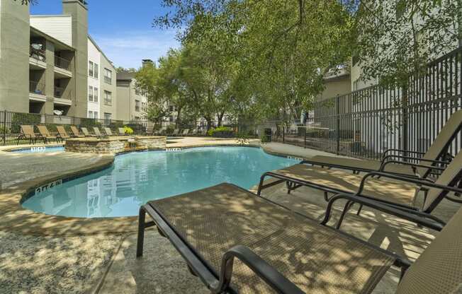 our apartments have a resort style pool and lounge chairs