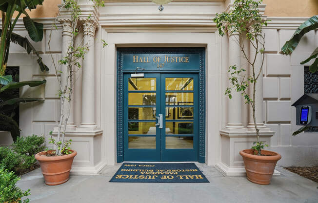 The entrance to a building called Hall of Justice.