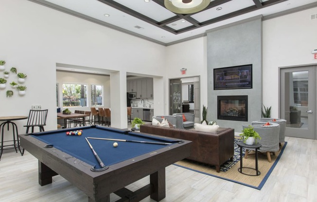 Clubroom with seating area, fireplace, TV, and pool table