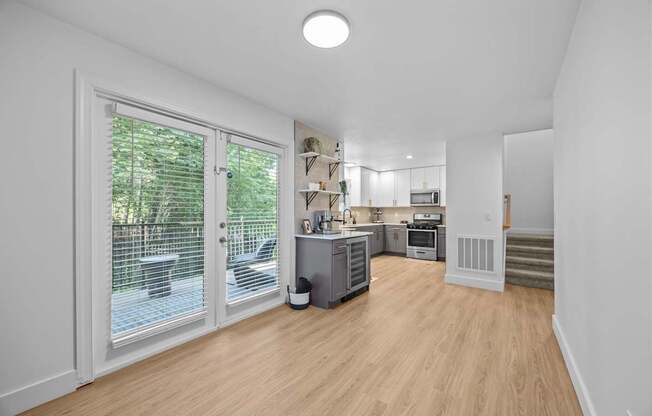 A kitchen area with a dining table and chairs.