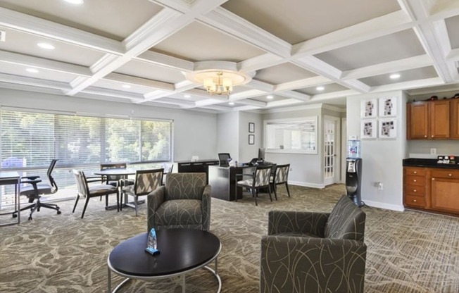 A spacious living room with a dining table and chairs.