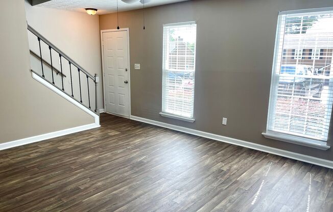 Welcome to this stylish and contemporary 2-bedroom, 1.5-bathroom corner townhome in Stockbridge!