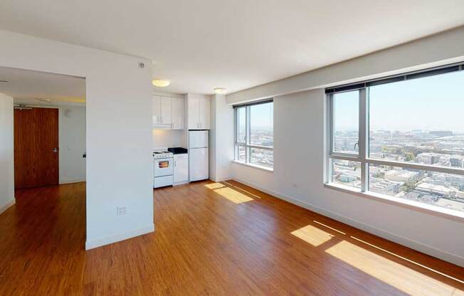 an empty living room and kitchen in an apartment