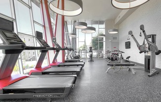 Up-to-date fitness studio with cardio and weight training equipment at Astro Apartments, Seattle, WA, 98109