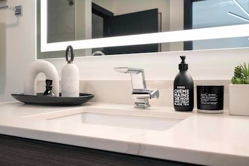 a bathroom with a sink and a mirror  at 220 Meridian, Indianapolis, IN 46204