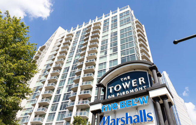 a tall building with a sign in front of it