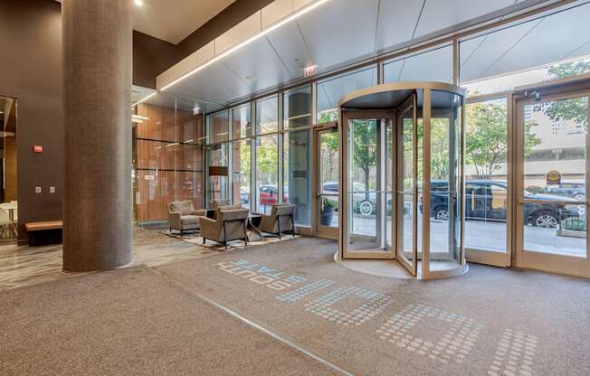 A hallway with a carpet that has the word "STAFF" on it.