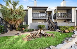 Richmond/Amanda west of Fondren, Classic, beautifully maintained, 2nd floor condominium offers 2 bedrooms and 1 bathroom. Features include a living area with fireplace, spacious dining area, and a kitchen with quartz countertops, white appliances, and cab