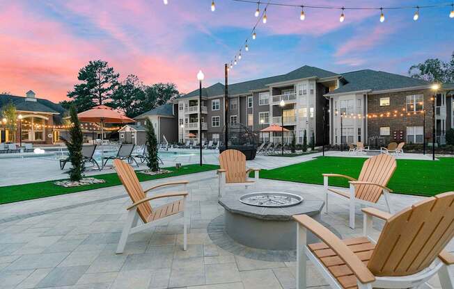 Outdoor entertaining area with firepit and bistro string lights