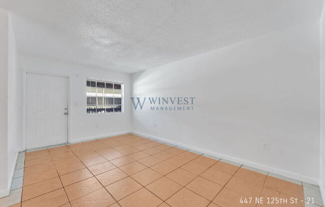 447 NE 125 ST