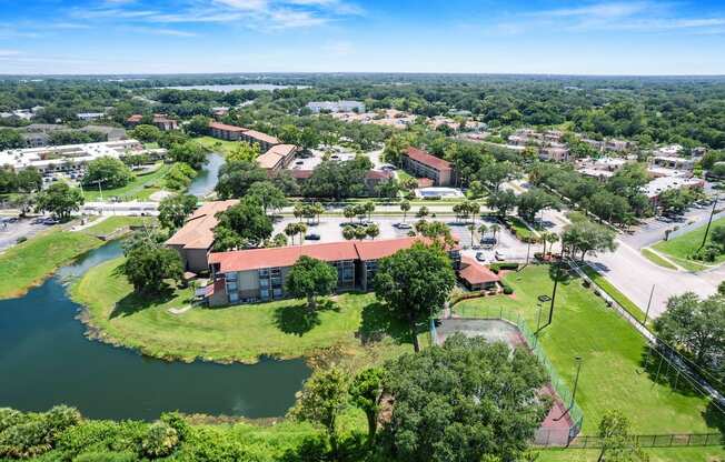 an aerial view of a city with a body of water