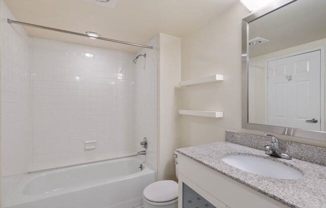 Renovated bathroom with granite countertops at Lenox Club, Arlington, VA