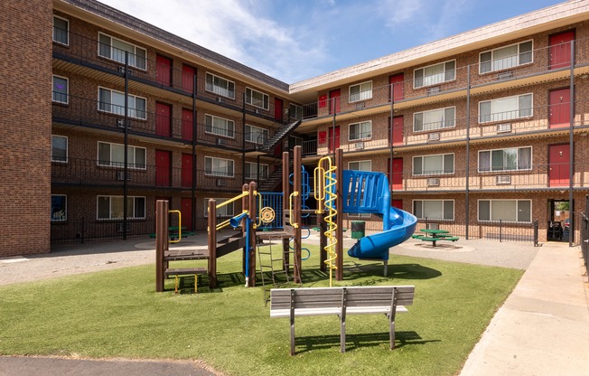 a playground in the middle of an apartment building