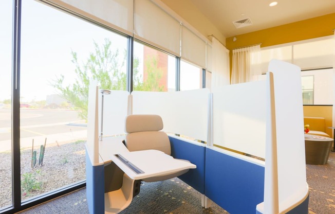 a public seating area with a chair and a window