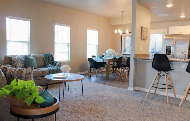 a living room filled with furniture and a large window