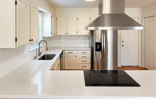 Charming 2 Bed Brick Home with Updated Kitchen, Hardwood Floors & Spacious Backyard