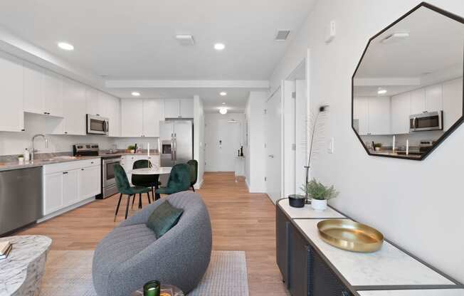 an open living room with a kitchen and a dining room