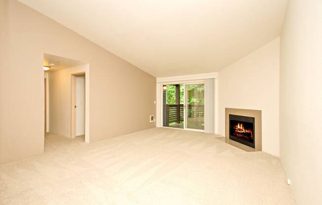 a living room with a fireplace and a window