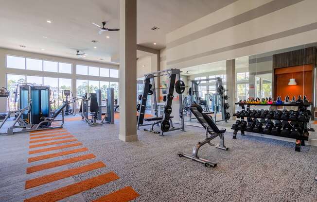 A gym with orange stripes on the floor.