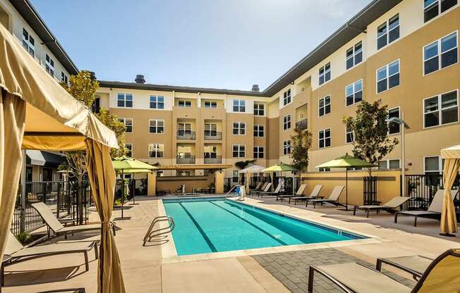 Apartments for Rent in Foster City, CA - The Plaza - Large Pool Area with Lounge Chairs and Cabanas