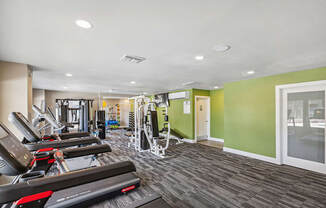 Community Fitness Center with Equipment at Saddle Ridge Apartments in Tucson, AZ.