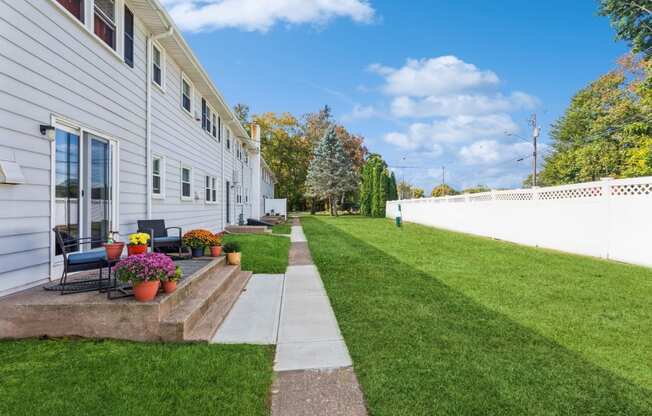 Back side of the apartments with pretty landscape and plants at Fox Hill Commons, Connecticut, 06066