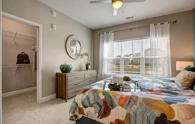 Big bedroom, Dresser, nightstands, carpet and walk in closet at Ascent at Mallard Creek Charlotte, NC