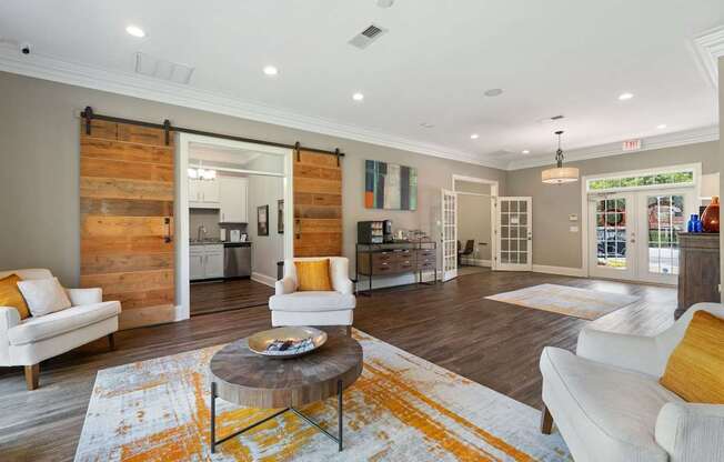 A living room with a white couch and a coffee table.