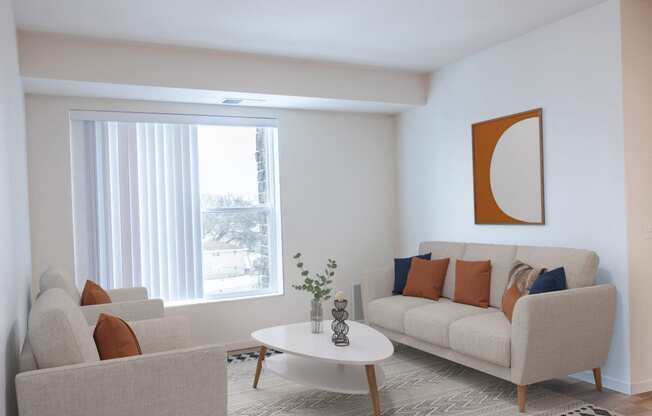 a living room with a couch and a table and a window