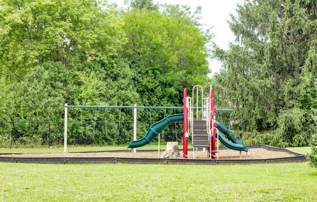 Playground with slides and swing sets at University Park Apartments