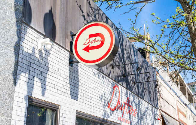 A Dirty Duck sign is on a building.