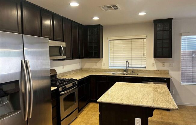 INCLUDES SOME UTILITIES 4 bedroom in Mountains Edge with Large Patio