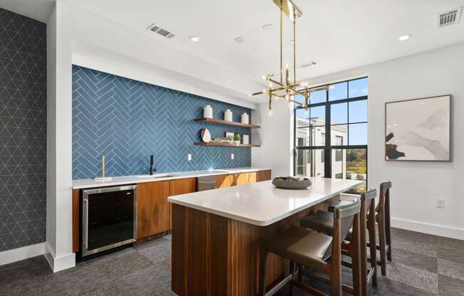 a kitchen with a large island and a dining table with chairs at The Colony, Charlotte, NC, 28211