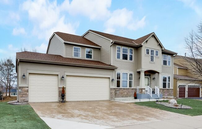 Grand 5 bed 4.5 bath Maple Grove Home w/ 3-Car Garage! Fully Furnished