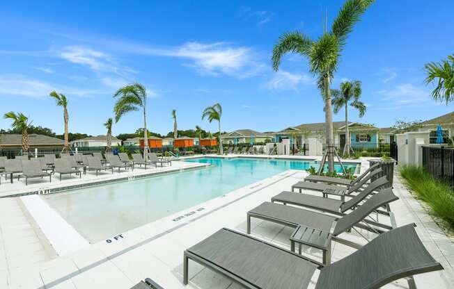 Sun deck next to a resort style swimming pool