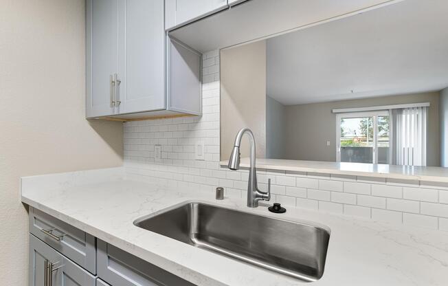 a kitchen with a sink and a window