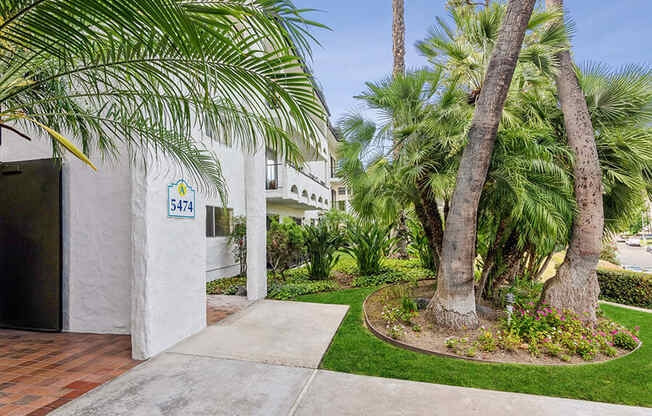 Exterior Community Building and Landscape at Palmilla Apartments located in San Diego, CA.