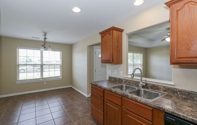 Here’s a more concise version of the description:  Spacious 4-Bedroom Home with Modern Upgrades