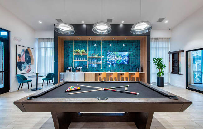 play a game of pool in our clubhouse at our apartments