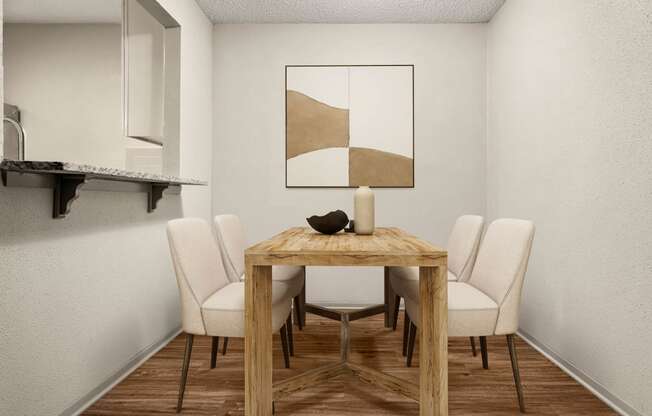 a dining room with a wooden table and white chairs at South Lamar Village, Austin