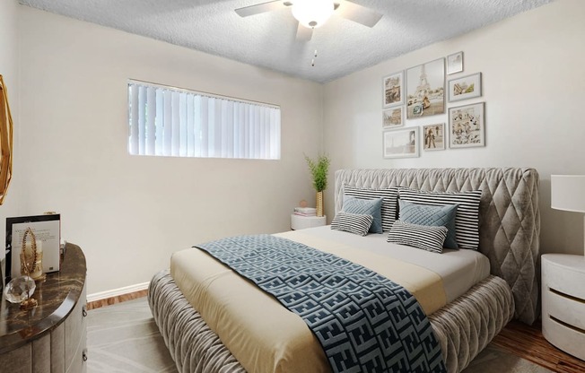 a bedroom with a bed and a ceiling fan