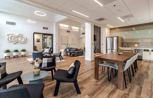A modern living room with a dining area and kitchen in the background.