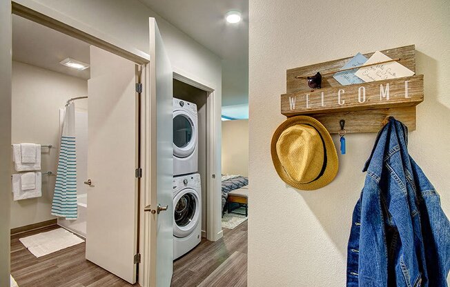 A laundry room with a washer and dryer and a coat rack with a hat and jacket hanging on it. at Ravello Apartments, Redmond, WA