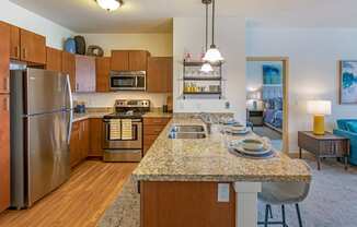 Kitchen with Island at The Enclave Luxury Apartments