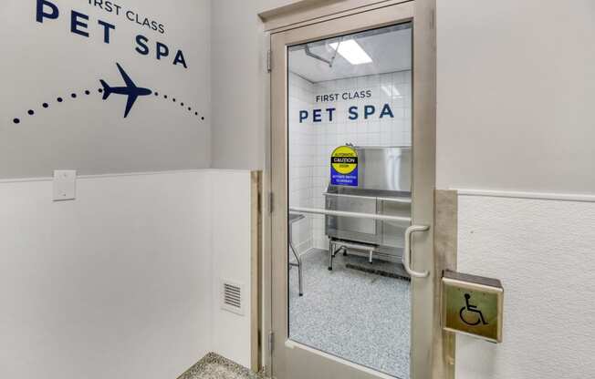 a glass door with a sign on the side of it that says first class pet spa