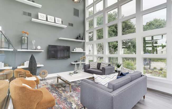 a living room with a large wall of windows