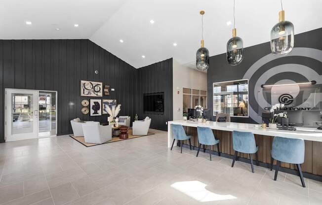 A modern dining room with a long table and chairs.