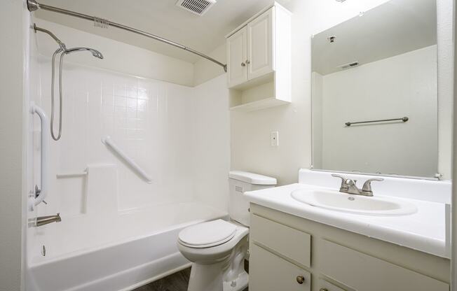 a bathroom with a bathtub toilet sink and mirror at Sagewood Gardens Senior Apartments, California, 91745