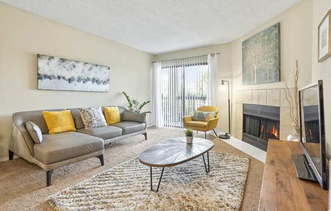 a living room with a fireplace and a couch