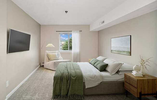 Model bedroom with a bed and a window at Stone Ends apartments in Stoughton, MA
